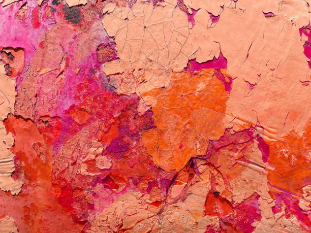 istock Colorful pink and orange cracked paint texture on a wall - abstract texture 1577130152
