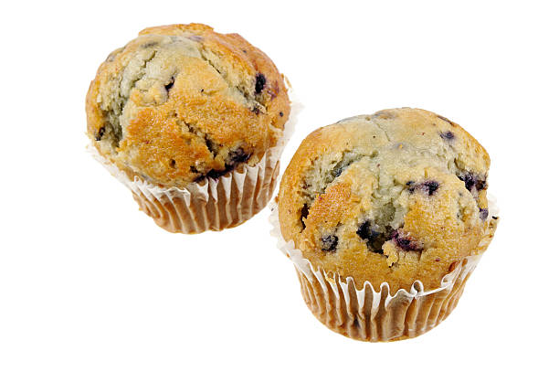 dos bollos de arándanos aislado en blanco - muffin blueberry muffin blueberry isolated fotografías e imágenes de stock