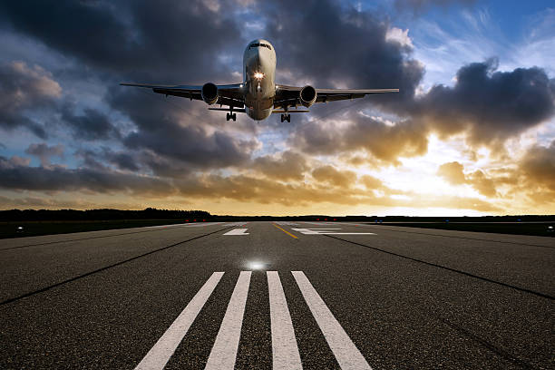 XXL jet airplane landing at sunset