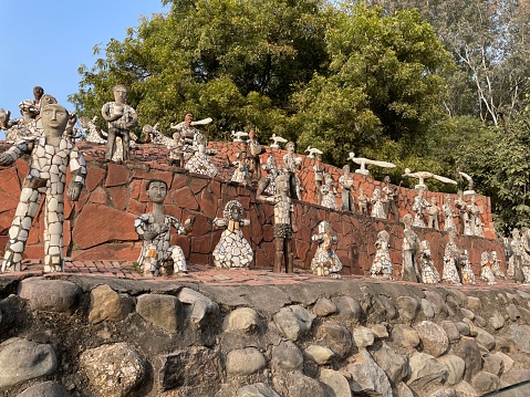 Rock Garden of Chandigarh, Sector 1, Chandigarh, India - January, 04 2023: Stock photo showing close-up view of the recycled ceramic statues in the sculpture park of the Rock Garden of Chandigarh, also known as the Nek Chand Saini's Rock Garden of Nathupu.