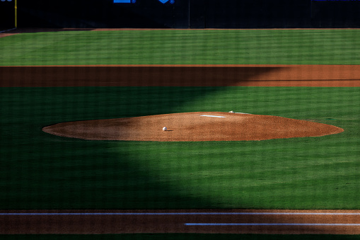 Empty baseball field with sunshine on it