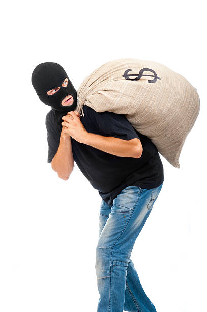 istock Happy robber with sack full of dollars 157716321