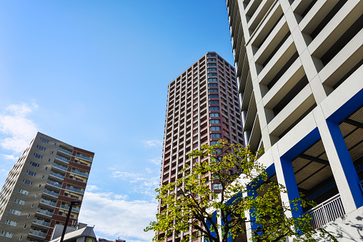 Housing complexes, blue sky background. Kanagawa Prefecture, Japan.