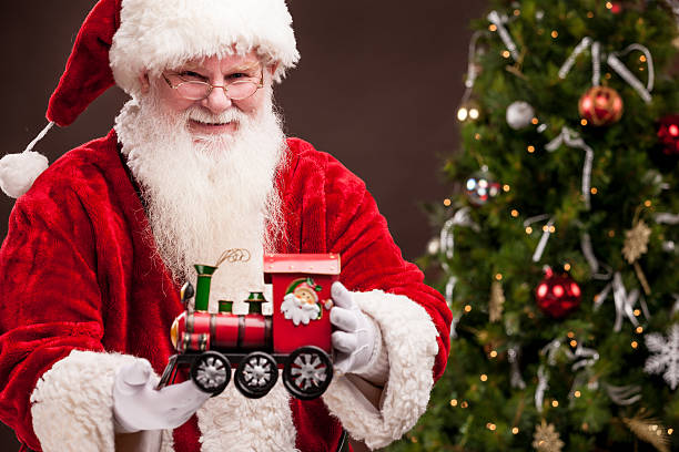 istock Real Santa Holding Toy Train 157717992