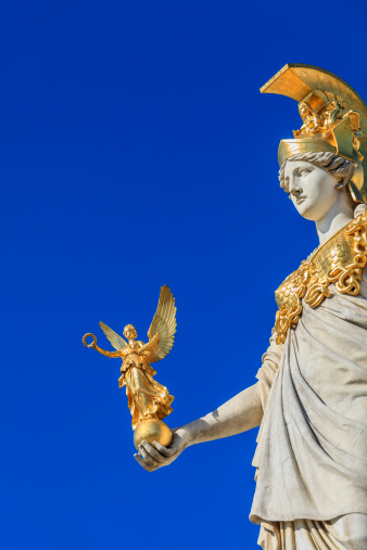 The goddess of wisdom Athena carries in her hand a gilded Nike.  These sculptures are part of the monumental complex Pallas-Athene Fountain (Pallas-Athene-Brunnen), a wonderful example of artwork created between 1893 and 1902. It stands in front of the Austrian Parliament building, a Greek revival style palace. This impressive architectural complex is one of the most famous landmarks of Vienna. 