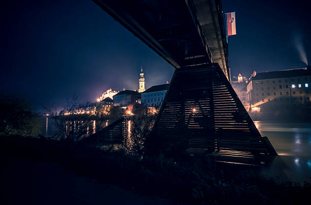 Panorama of the old Town of Burghausen. Photographed over the Salzach at a public place in Austria. Burghausen is a small town in Bavaria at the border with Austria. In the foreground you can see the Salzach River, which forms the border with Austria. In the background the castle of burghausen.