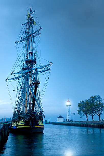 istock frigate from the 18th century moored in harbor at dawn 157718970