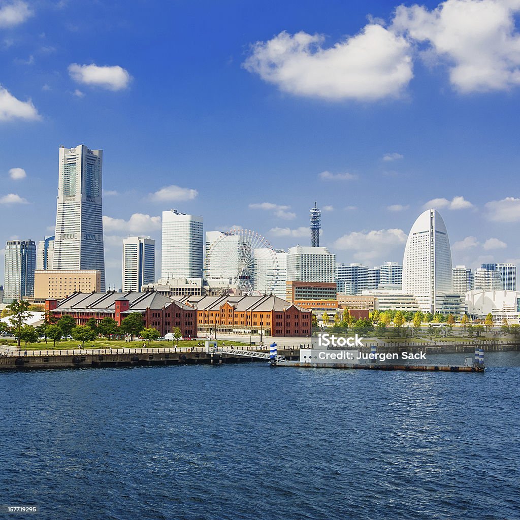 Cityscape of Minato Mirai 21 district in Yokohama, Japan Yokohama´s skyline with the Landmark Tower, Queen's Square and the ferries wheel with the Aka-Rengo Soko warehouse on a beautiful October day Yokohama Stock Photo