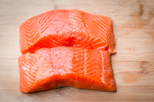 Raw Salmon Filets on a cutting board