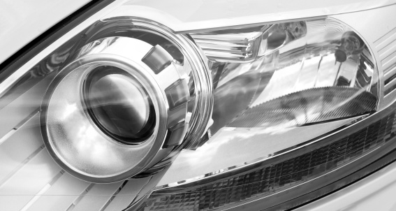 part of a modern car xenon light, black and white image, taken with full format camera and prime lens