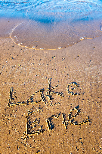 Lake Erie written in sand  on beach at Lake Erie Ontario Canada Aug 1 2023