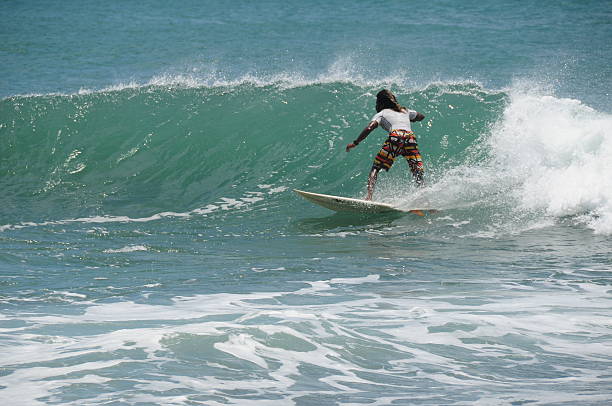 Durban, South Africa - February 21, 2011: Surfing Surfer rides inside summer cyclone wave at New Pier beach.