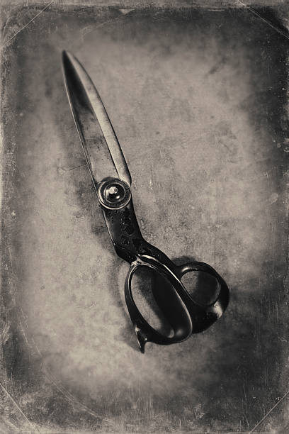 A pair of tailor's shears. Toned black and white with scratches  and vignette added.http://i895.photobucket.com/albums/ac158/jameswhittaker_bucket/iStockBanner2011ArtisansMaster.jpg