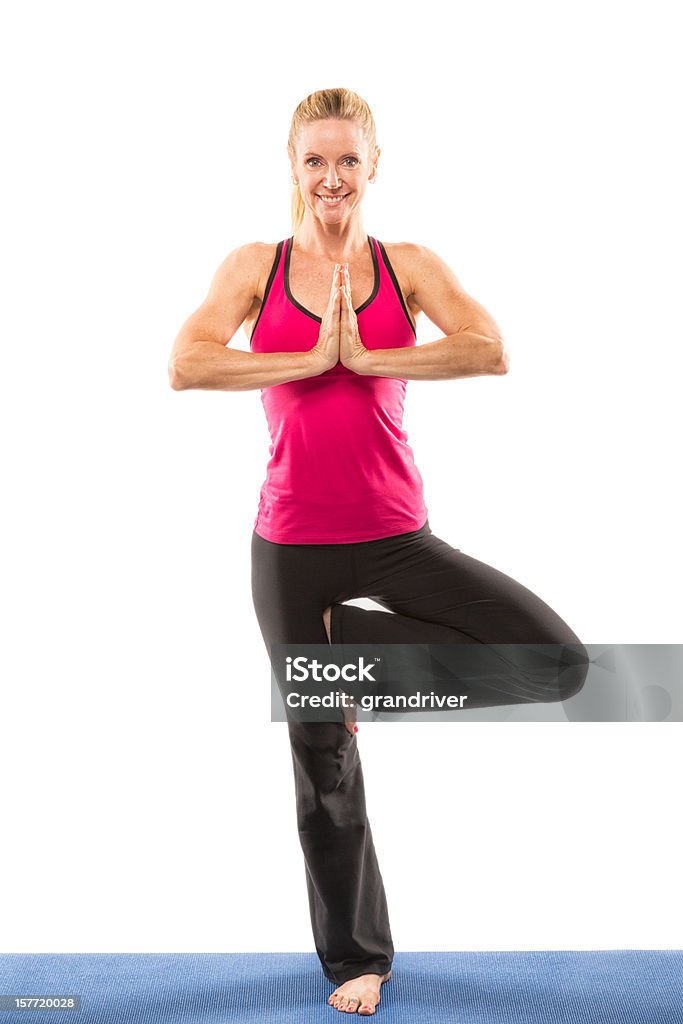 Женщина делает Йога - Стоковые фото 25-29 лет роялти-фри