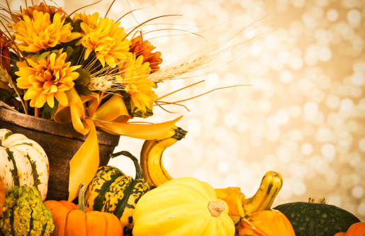 Thanksgiving arrangement with autumn flowers, gourds and pumpkins