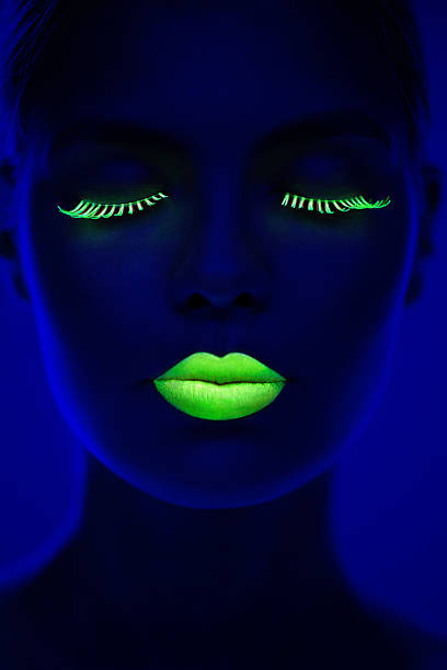 Women Portrait in Neon Light Young women portrait in Ultraviolet Light. body paint stock pictures, royalty-free photos & images