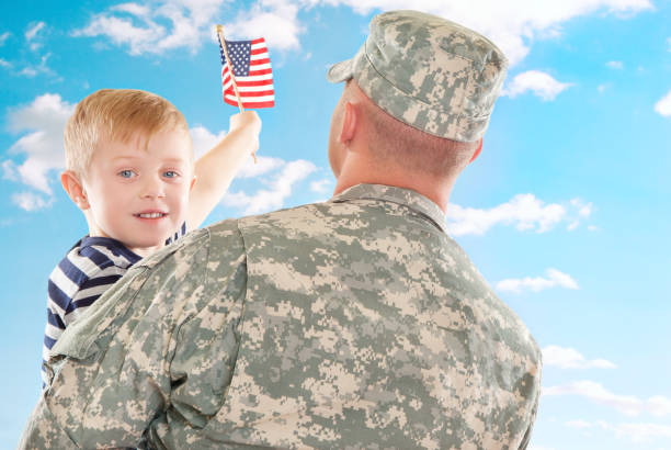 istock Real American Soldier & Son Against Blue Sky 157720500