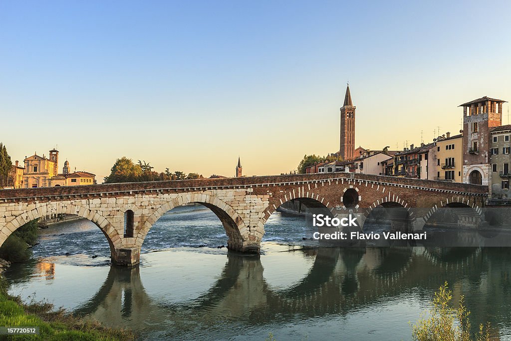 Magnificent view of Ponte Pietra of Verona at sunrise The old Ponte Pietra is a five-arched bridge that crosses the river Adige and is a valuable evidence of the Roman period. Verona, Italy. Verona - Italy Stock Photo