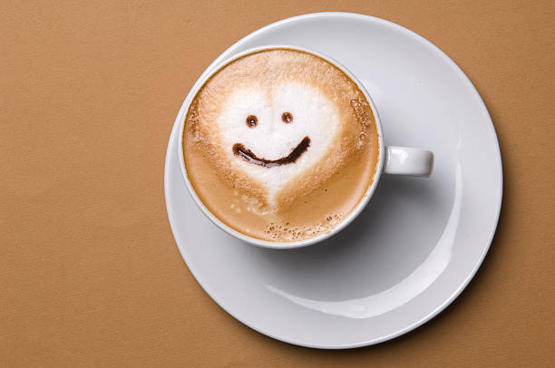 Cappuccino Cup of cappuccino with smiley face. anthropomorphic face photos stock pictures, royalty-free photos & images