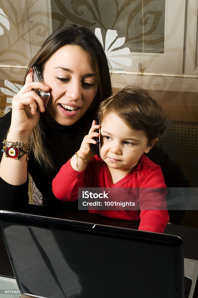 working mum with her little daughter Baby - Human Age Stock Photo