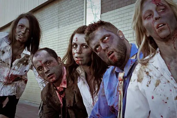Photo of A group of adult zombies at a bus stop