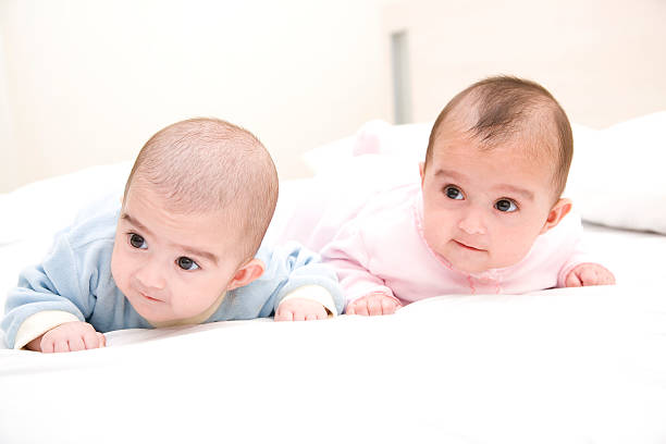istock Baby Girls Lying on Bed 157721844
