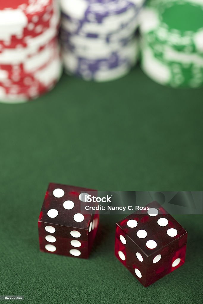 Craps 11, Wins on Pass Bet, Casino, Dice, Gambling Chips Dice roll a natural eleven, which is a win on a pass bet. Selective focus on die showing six. Number 11 Stock Photo