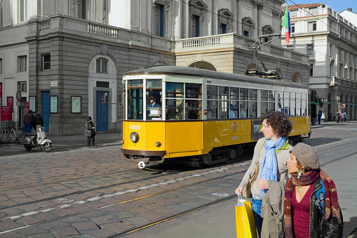 Moscow, Russia - September 18, 2020: Traffic of the public transport at the city street. Modern Cable car photography. Woman - driver. Tram stop. Side view.