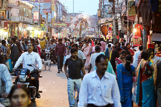 Bustling night time market at Varanasi, India  india indian culture market clothing stock pictures, royalty-free photos & images