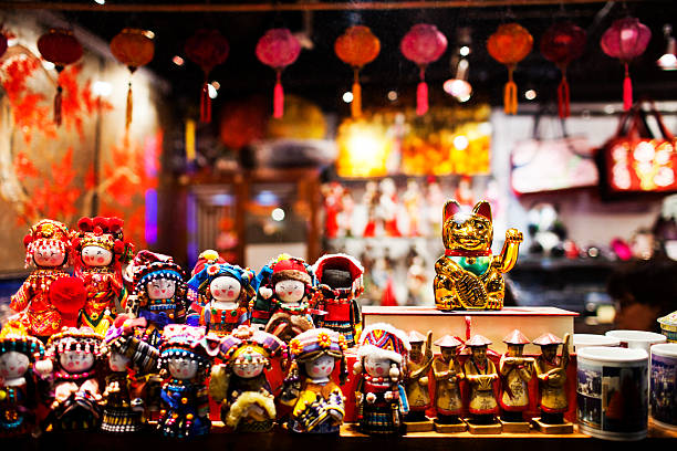 Hong Kong, China - September 26, 2011: Figurines behind window display in souvenir store in Hong Kong.