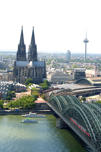 view of the east side of cologne cathedral from the hohenzollern bridge to the crossing tower and the impressive twin towers