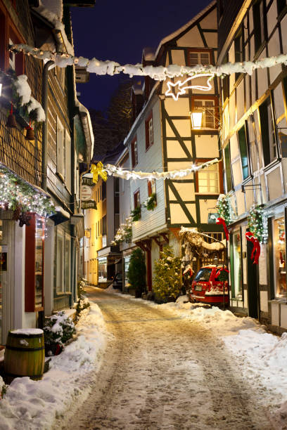 Munich, Germany - January 01, 2015 - Festively decorated building exterior with lights and statues at night.