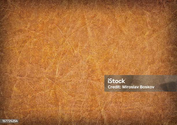 Hires Antique Amber Brown Parchment Wizened Mottled Vignette Grunge Texture Stock Photo - Download Image Now