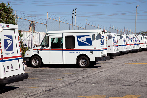 Redondo Beach, California, USA - November 9, 2011: United States Post Office mail delivery trucks await deployment in Redondo Beach, California.