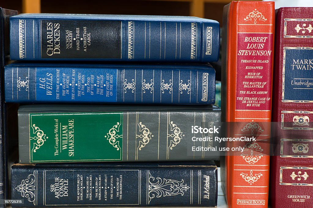 Leather Bound Books. Mahone Bay, Canada - November 10, 2011: A stack of leather bound books from several classic authors and various publishers.  These books were published in the 1980s and were popular to collect at that time. Charles Dickens Stock Photo