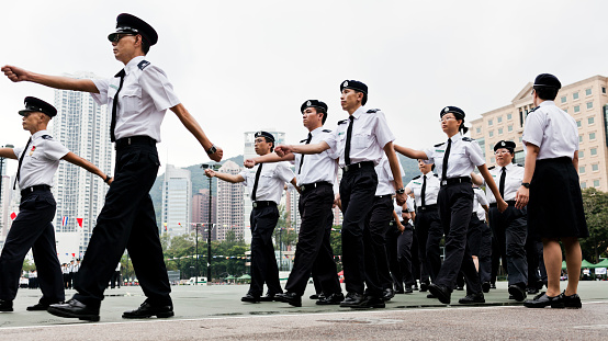 Hong Kong, China - September 25, 2011: Policement parade in open area beside Victoria Park in Causebay Bay Hong Kong
