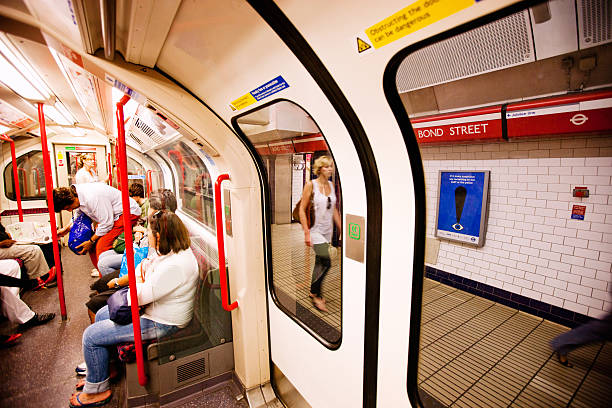 Woman using card for getting through ticket barrier
