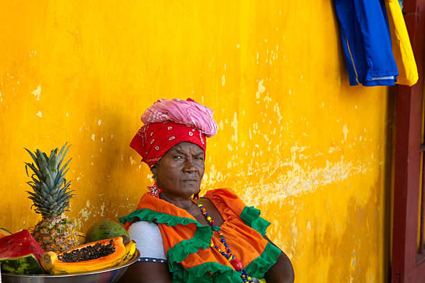 Woman in Traditional Garb, Cartagena, Columbia with Bowl of Fruit stock photo