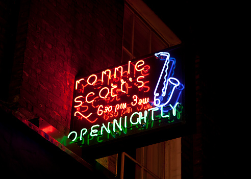 London, UK - May 7, 2011: Night shot of Ronnie Scott's jazz club in Frith Street, London. A landmark of Soho nightlife,