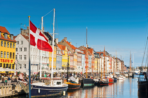 Alesund, Norway - November 1, 2023: Winter city scapes on November 1, 2023 in Alesund, Norway. City life in Alesund, with fishing boat in the canals of the harbor