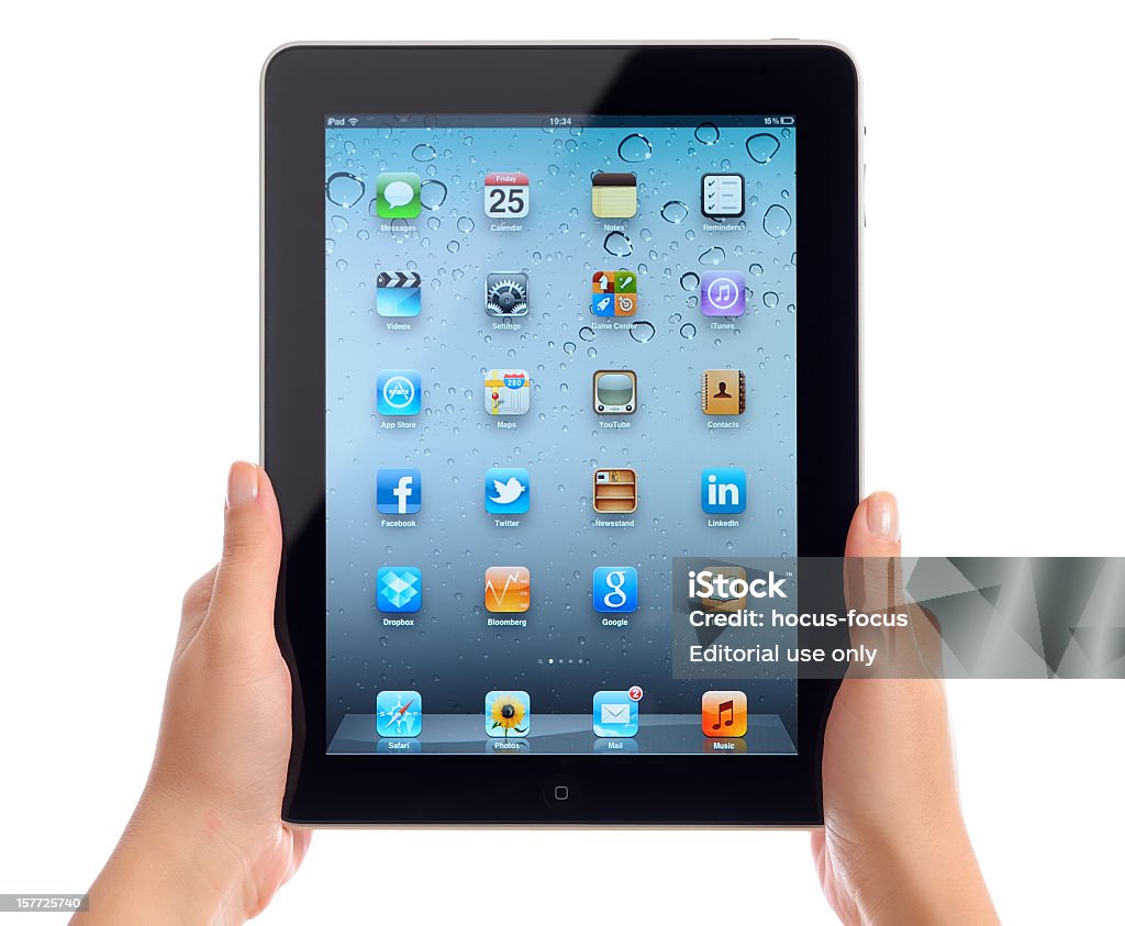 Hält iPad von Apple iOS 5 - Lizenzfrei Freisteller – Neutraler Hintergrund Stock-Foto