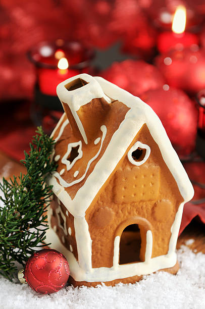 istock Gingerbread house with candle and Christmas ornaments 157725760