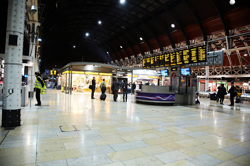 Train arriving at station and one leaving. High angle view.