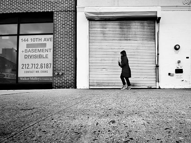 Remain indoors written on the road during coronavirus pandemic.