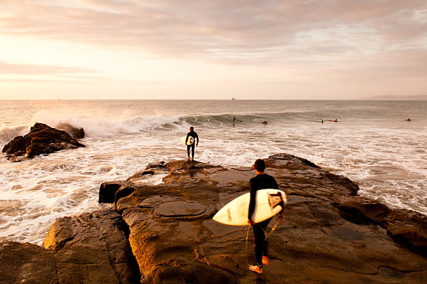 Surfing in Peru at sunset stock photo