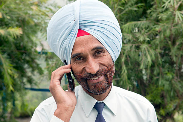 Indian chickpeas Farming , happy indian farmr holding mobile phone in hands, poor happy farmer