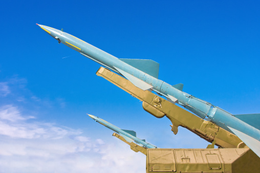 Two missiles aimed at the blue sky. Medium-range surface-to-air missile.