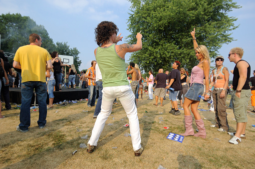 Turin, Italy - July 12, 2014: Young people attending a rave party at Holi Fusion Indian festival in Parco Dora park