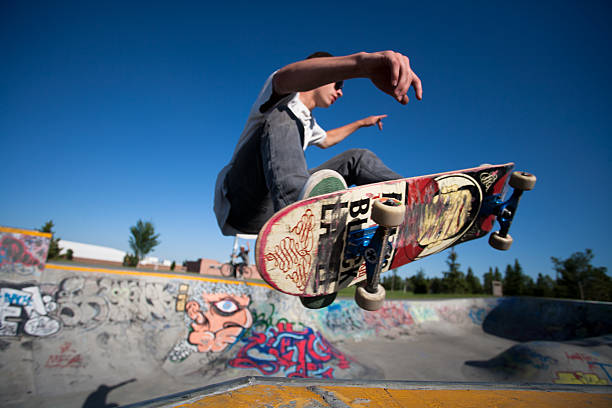 Skateboarder at a skate park stock photo