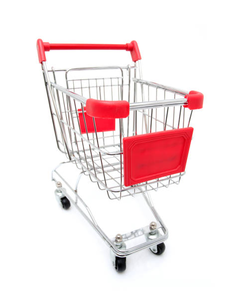 Shopping, discount, sale concept. Mall shopping. Buy products. Child playing shopping trolley cart, basket. Play shop game. Cute buyer customer client hold shopping cart. Buy with discount.